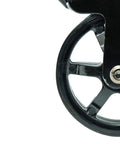 Close-up of a single wheel from a 3 Inch Polyurethane Black Mag Designer Caster Set With Non Marking Floor Protection, showing metal spokes.