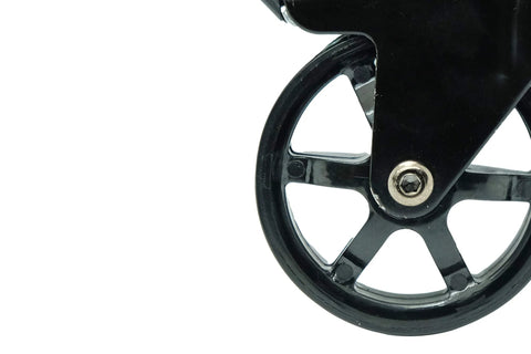Close-up of a single wheel from a 3 Inch Polyurethane Black Mag Designer Caster Set With Non Marking Floor Protection, showing metal spokes.