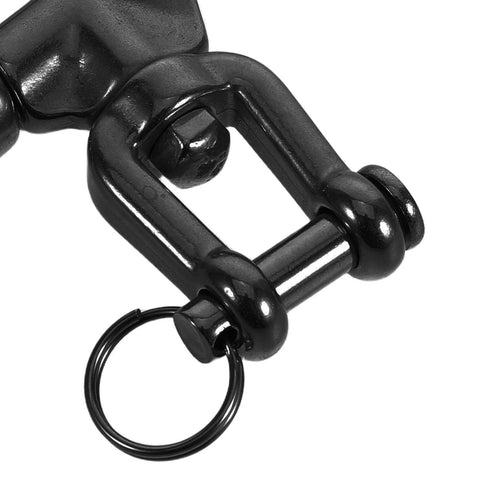 Close-up of black stainless steel quick-release snap shackle with swivel eye and key ring.