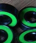 16 Roller Skate Black Bearing - Bronze Cage & Green Seals showing green rubber seals and black outer casing.
