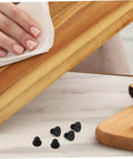 20 Pack Rubber Feet Replacement For Rice Cookers And Pressure Cookers Non Slip Bumpers shown on countertop with wooden board