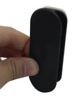 Close-up of hand holding Two Pack Self Adhesive Pull Handles For Cabinets Doors Drawers Windows Closets And Clothing Boxes Black Easy Install