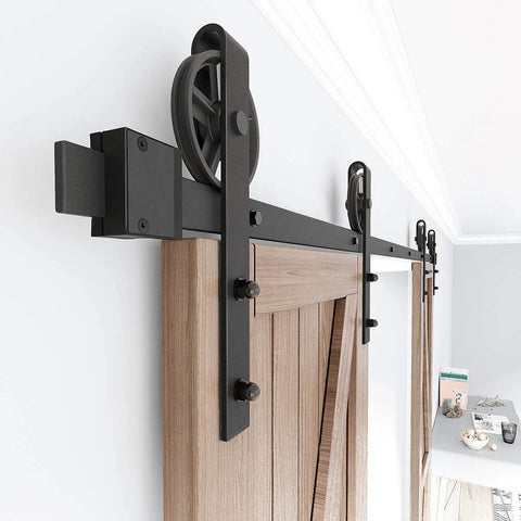 Installed Premium Black Finish Wood Double Sliding Barn Door Hardware Kit With Big Spoke Wheel Rollers, steel tracks on wall