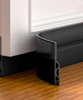 Adjustable Door Sweep For Bottom Of Door Made From Thick Silicone Weather Stripping That Keeps Drafts And Noise Out Durable Under Door Gap Filler For Interior And Exterior Doors Low Friction No Slip Felt Black 39 Inch installed on a door.