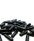Fifteen Pieces Silicone Vacuum Caps One Quarter Inch High Temperature Black Blanking Masking Tubing Caps scattered on surface