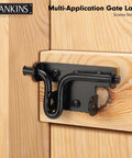 Heavy Duty Black Slide Bolt Gate Latch For Wooden Fences And Vinyl Gates With Padlock Hole, installed on wood fence