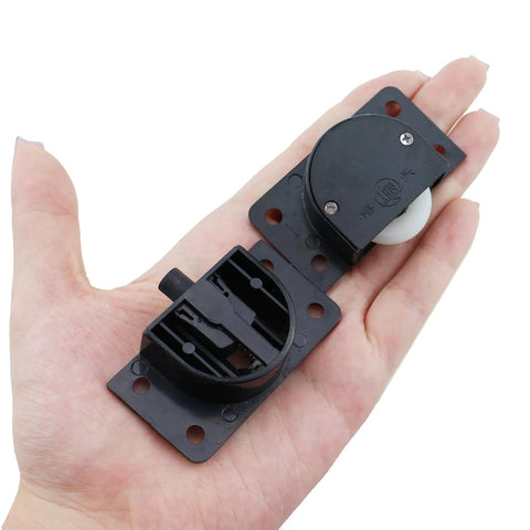 Black Sliding Cabinet Hardware Components 2 Sets With Four Sliding Door Rollers And Nylon Pulley And Mounting Screws in hand