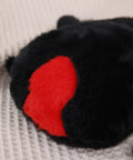 Close-up of the Ultra Soft Black Spider Plush Toy For Kids And Adults, highlighting the red accent on the back.