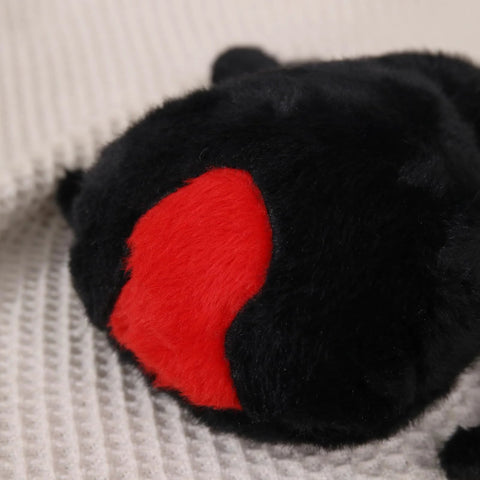 Close-up of the Ultra Soft Black Spider Plush Toy For Kids And Adults, highlighting the red accent on the back.