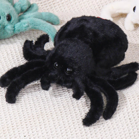 Ultra Soft Black Spider Plush Toy For Kids And Adults on beige surface, 9.8-inch cozy huggable jumping spider stuffed animal pillow.