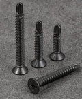 600pcs #8 x 1/2 Inch Flat Head Self Tapping Sheet Metal Screws, Black Stainless Steel, with deep threads on grey surface