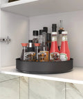 Stainless Steel Lazy Susan Turntable For Pantry Cabinet And Kitchen Organization, 7.5 Inch Spinning Rack For Spices, Snacks, And Bathroom Storage, Black Finish, Rustproof 304 Stainless Steel With Rimmed Edge To Prevent Slips displaying spice bottles