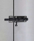 Close-up of Heavy Duty 6.3 Inch Gate Latch Barrel Bolt Slide Lock in Solid 304 Stainless Steel with Black Finish, Installed on Door