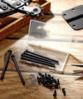 Six Pack Three Point Five Inch Hinge Pins For Doors Stainless Steel Replacement with screws on wooden surface