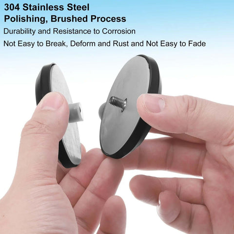 Hands holding Round Glass Shower Door Handles Back-To-Back In 304 Stainless Steel Black, showing screw fixing mechanism.