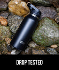 Beast Mode Heavy Duty Stainless Steel Water Bottle 40 Oz Insulated Tumbler With Leakproof Flip Straw Lid on rocks