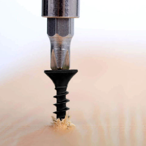 #8 x 3/4 Inch Black Phosphate Stainless Steel Wood Screws being drilled into wood surface