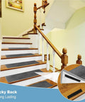 Stairs with dark tread mats attached using Heavy Duty Adhesive Strips Roll 26.5 Feet By 1.2 Inches Self Adhesive Nylon Back Fastener Tape.