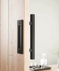 Heavy Duty 12" Pull and Flush Barn Door Handle Set, Large Rustic Two-Side Design, installed on wooden door, solid steel, black.