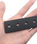 Black Carbon Steel Barn Door Track Splice Piece 80mm metal splice plate repair fastener shown in hand with four countersunk holes