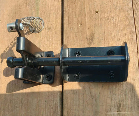 Self Locking Gate Latch For Outdoor Fences In Black Steel With Automatic Gravity Lever Lock Installed on Wooden Gate