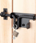 Slide Bolt Gate Latch with Padlock Hole on wooden door, black steel construction for outdoor fence and shed security