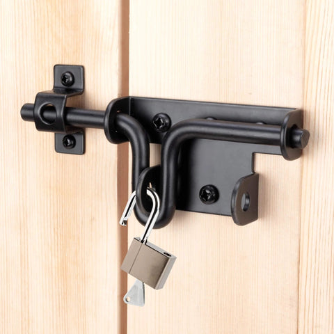 Slide Bolt Gate Latch with Padlock Hole on wooden door, black steel construction for outdoor fence and shed security