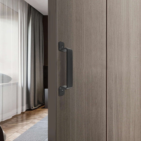 Sliding Barn Door Handle Black Steel, 7.5 Inch Length, installed on a wooden door in a modern interior