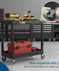 32 Inch Tub Storage Cart With Two Shelves Black Built For Maximum Capacity Ergonomic Top Handle And Super Handy Maneuver Four Swivel Casters With Two Locking Brakes Molded Plastic Shelves And Legs Won't Stain Scratch Dent Or Rust shown with tools in garage setting