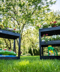 32 Inch Tub Storage Cart With Two Shelves Black Built For Maximum Capacity Ergonomic Top Handle And Super Handy Maneuver Four Swivel Casters With Two Locking Brakes Molded Plastic Shelves And Legs Won't Stain Scratch Dent Or Rust shown in a garden setting