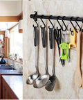 Gourmet Kitchen Utensil Rack with 6 Hooks, Wall Mounted Rail Wrought Iron Hanging Utensil Holder Rack with Removable S Hooks 16 Inch in use
