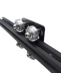 Close-up of Black 2020 Aluminum Extrusion V-Slot Gantry Plate Set w White Wheels on rail