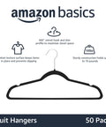 Maximize closet space with a 50-pack of slim velvet non-slip hangers, black with silver hooks, supporting up to 10 lb each, front view.