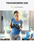 Woman using touchscreen with Black Vinyl Disposable Gloves Medium Size Latex Free And Powder Free Food Grade Gloves.