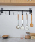Kitchen Utensil Holder Hanger, Pot and Pan Rack Wall Mounted with 8 hooks for cooking utensils, black, installed with utensils hung