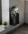 Wall-mounted Multifunctional Kitchen Utensil Rack Draining Chopstick Holder in black with cutlery on a kitchen wall