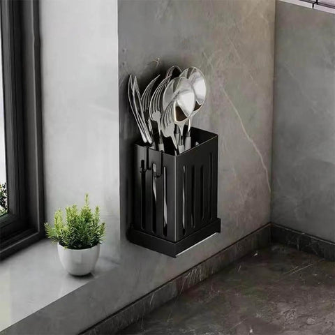 Wall-mounted Multifunctional Kitchen Utensil Rack Draining Chopstick Holder in black with cutlery on a kitchen wall