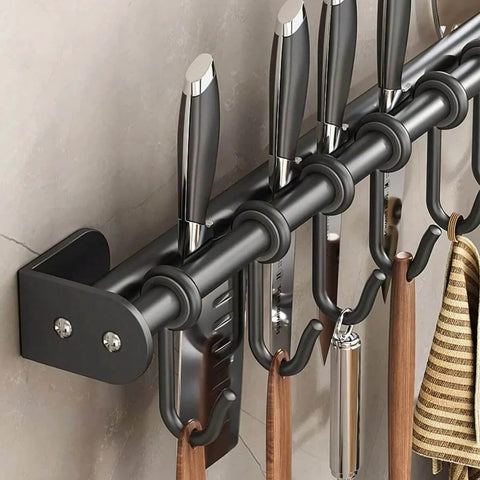 Close-up of Modern Kitchen Utensil Rack, Black Wall-Mounted Hanging Rod with 6 Movable Hooks holding kitchen tools.