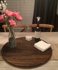 24 Inch Black Walnut Wood Lazy Susan Round Turntable for tabletop use, featuring a vase with flowers, wine bottle, and coasters.