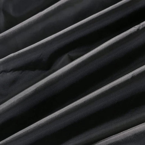 Close-up of black waterproof 420D oxford fabric, ideal for protecting top load washers from sun, dust, rain, and scratches.