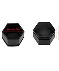 Close-up of two black plastic auto hub screw covers, 19mm and 21mm, from 20 Pcs Universal Car Wheel Nut Caps And Auto Hub Screw Covers set.