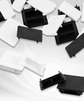 End Caps For Strut Channel 1-5/8 Inch By 13/16 Inch Black Square PVC Cap Protects Unistrut Channel Ends From Scratches Debris And Impacts, Provides Vibration Resistant Fit, Protective Cover For Metal Tubing, 50 Pack scattered black and white caps.