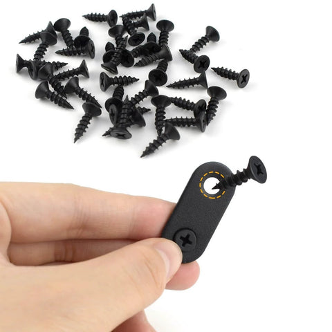 Hand holding a black metal mending plate with a screw from 20 Pack Flat Straight Brace Flat Straight Bracket Stainless Steel Flat Plate Straight Brackets Repair Mending Bracket Plate.