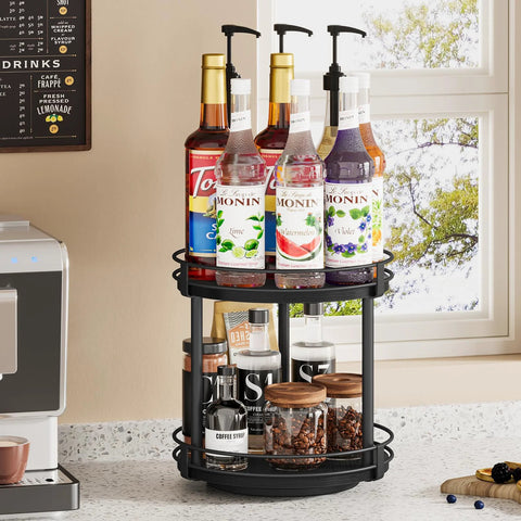 Two Tier Wooden Lazy Susan Spice Rack With 360 Degree Rotation for countertop displaying syrup bottles and coffee supplies, black finish.