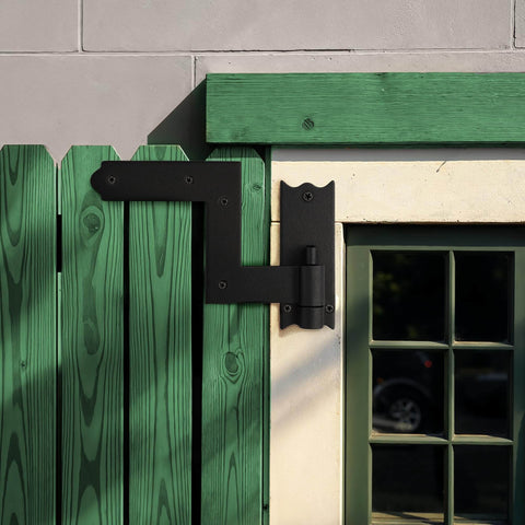Heavy-Duty Black Wrought Iron Shutter Hinges with lift-off pintles installed on a green wooden gate, 6.5 inch size