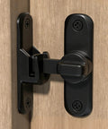 Black zinc alloy right angle door lock latch on wood, dual 90 and 180 degree gate latch for barn doors, space saving design.