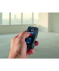 Effortlessly capture precise room dimensions and layout distances with a compact Blaze laser distance meter in use.