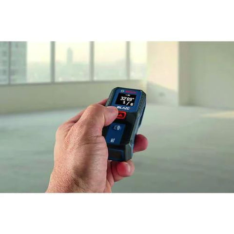 Effortlessly capture precise room dimensions and layout distances with a compact Blaze laser distance meter in use.