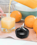 3.94 Inch Rubber Gasket Replacement Seal Kit With Brush And Hook For High Performance Countertop Blenders White O Ring For 7 Fin Blades Fits Models BL480 BL680 BL910 CT680 Durable No Spill Leak Free Seal Set For Smooth Blending shown next to fresh orange juice
