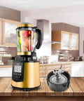Kitchen blender with gold base and fruit-filled jar, detachable blade set beside it, on a wooden counter in a modern kitchen.
